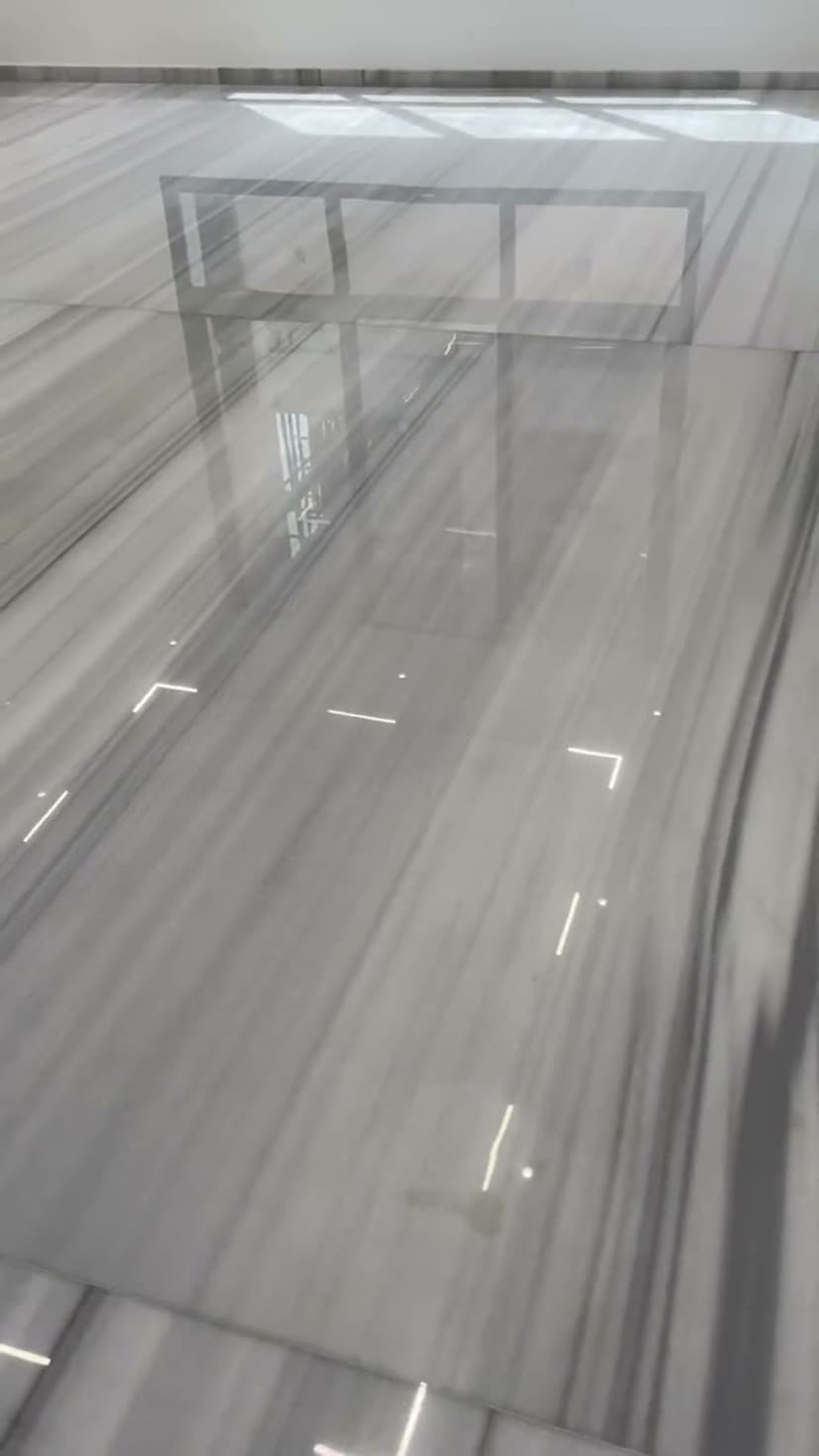 Marble floor restoration process showing professional grinding technique Dubai